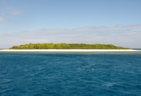 Sailing past one of the many islets off New Caledonia's southern coast